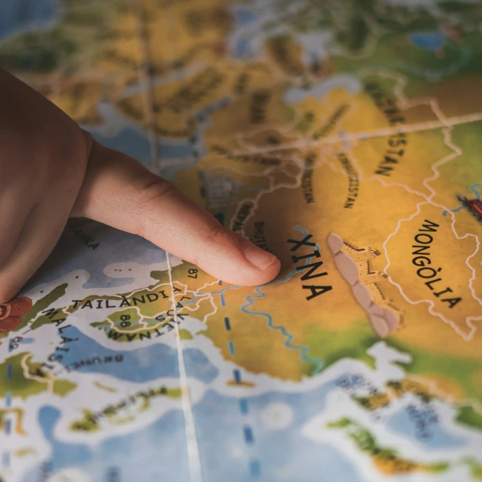 person holding yellow and green map